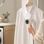 Portable mini clothes steamer being used on a white shirt in a home setting, highlighting its convenience and practicality.